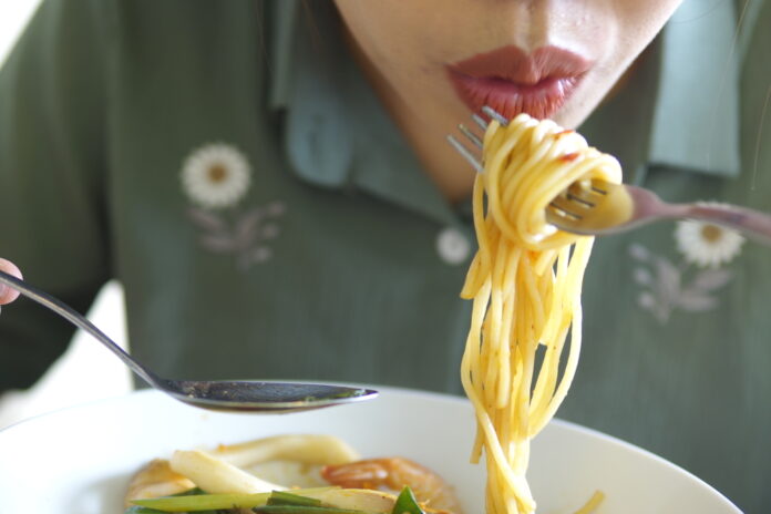 Eating,Spaghetti,With,Fork